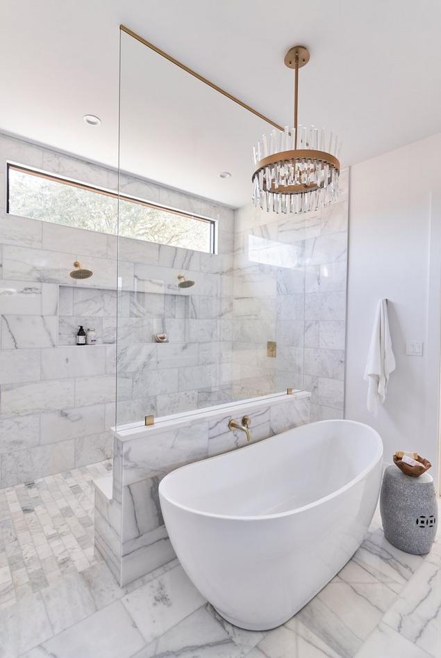 Primary Bathroom with Marble tiling & Tub